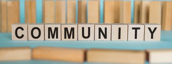 depositphotos_400316736-stock-photo-community-word-written-wood-block-1.webp